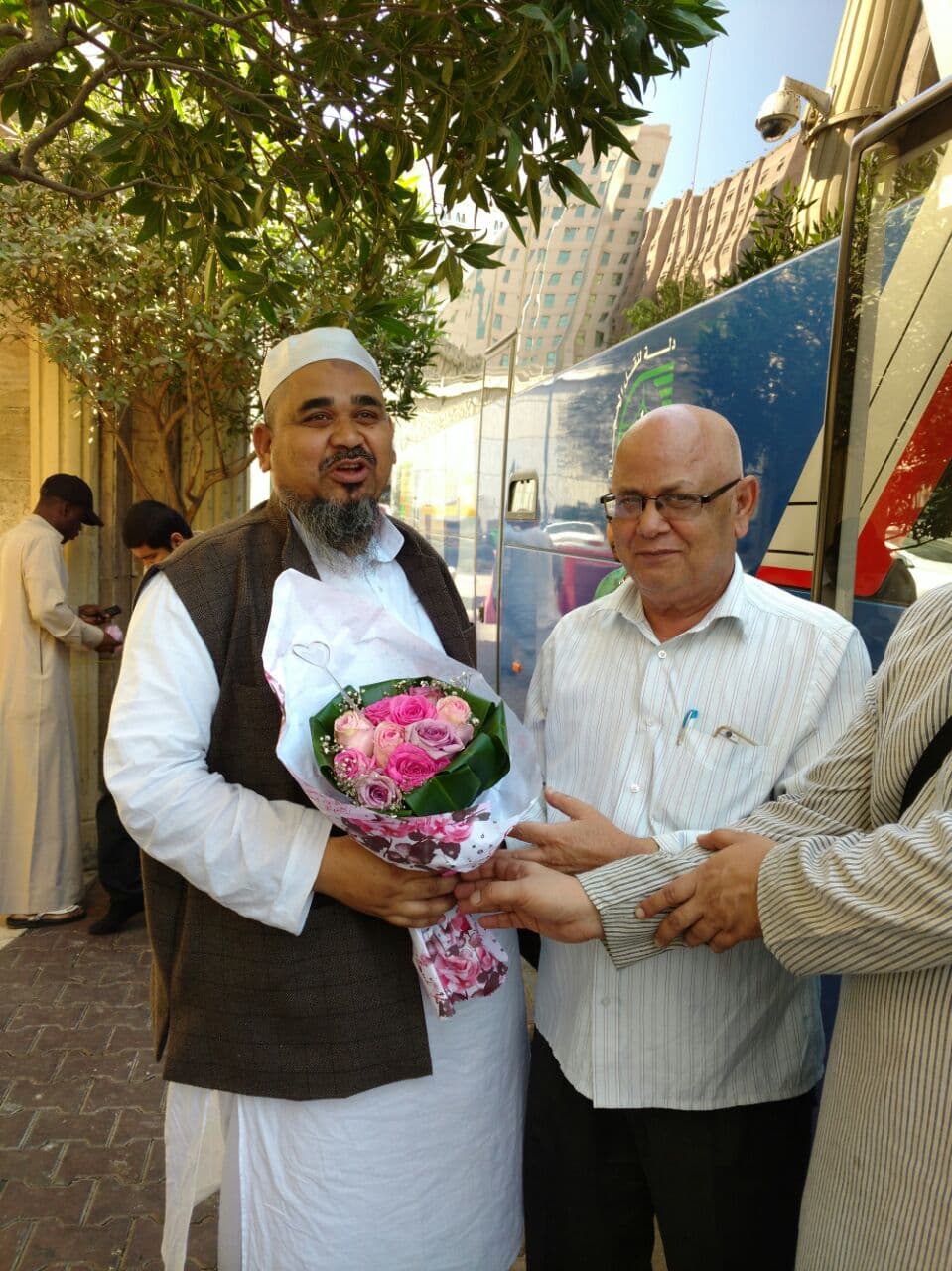 Dr. Irfan warmly welcoming Umrah guests on their arrival