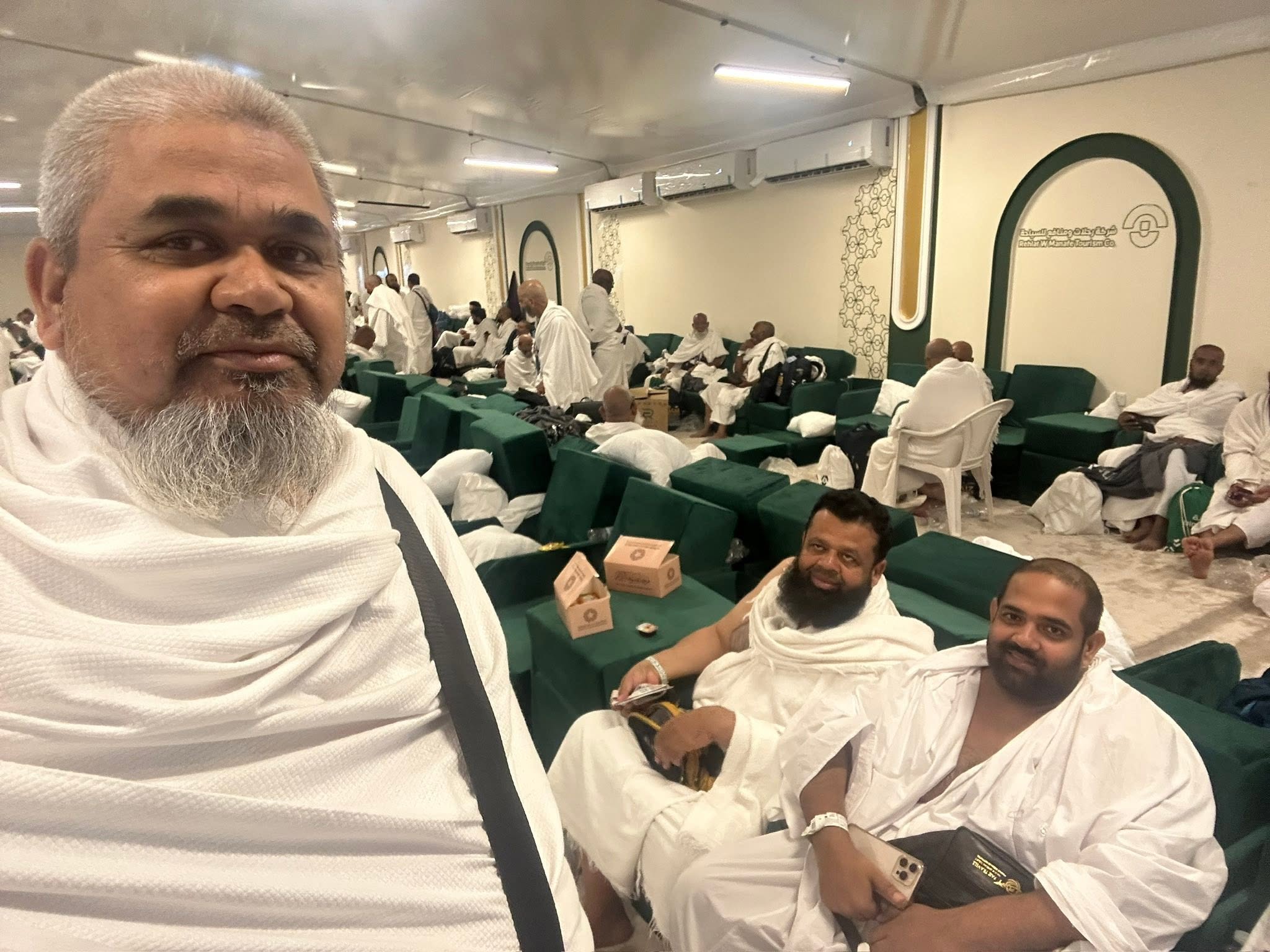 Group photograph of Dr. Irfan with Haj pilgrims