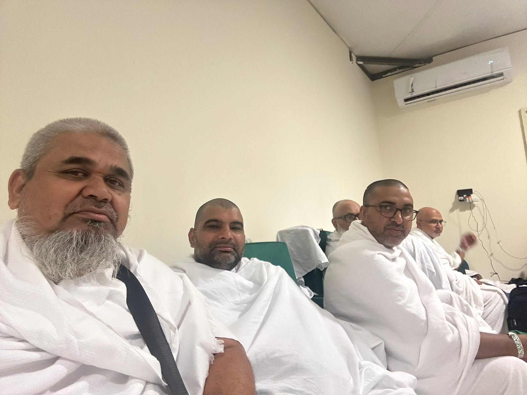 Dr. Irfan photographed with the Haj 2026 pilgrims group